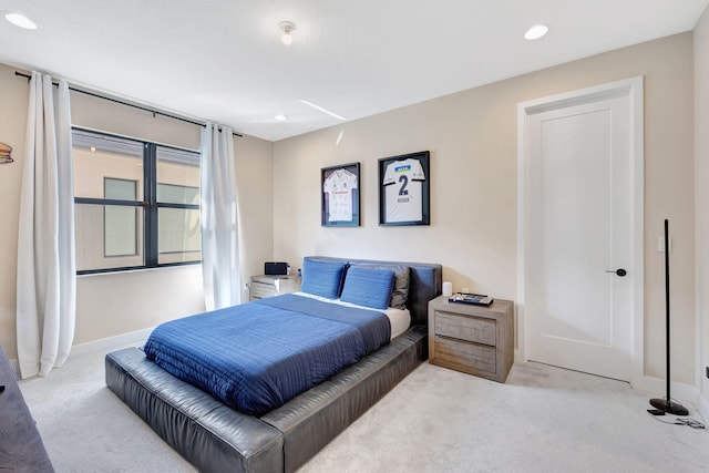 bedroom with light colored carpet