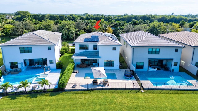 view of swimming pool featuring a patio area and a lawn