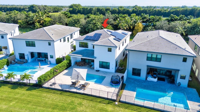 view of pool featuring a patio, a hot tub, and a yard