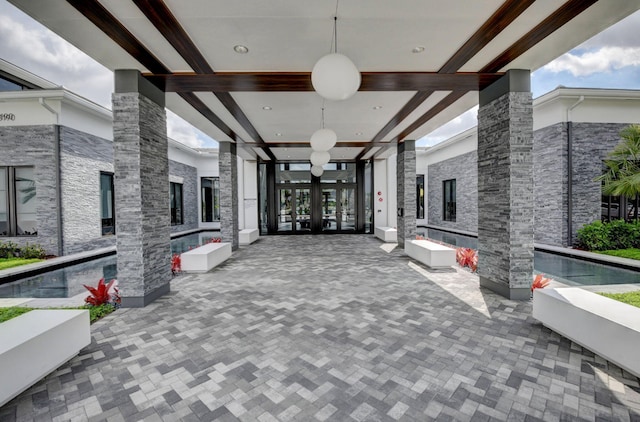 view of patio / terrace with french doors and ceiling fan