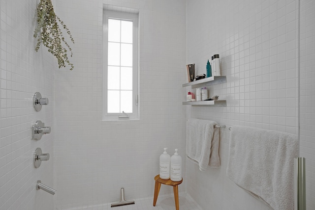 bathroom with tiled shower