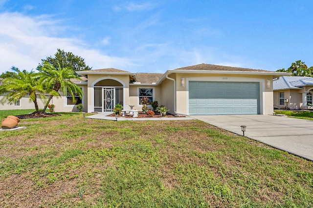 view of front of property featuring a front yard and a garage