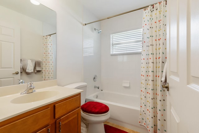 full bathroom with shower / bath combination with curtain, vanity, and toilet