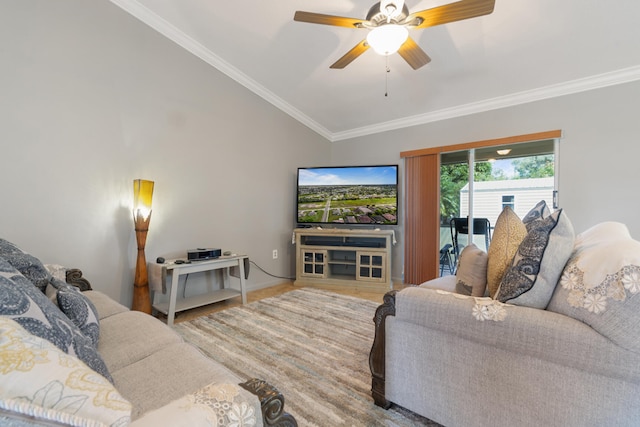 living room with ornamental molding, vaulted ceiling, hardwood / wood-style floors, and ceiling fan