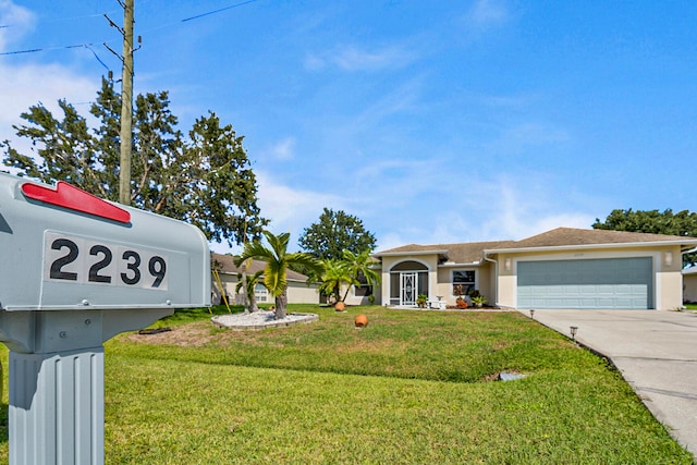 view of front of home featuring a garage and a front lawn