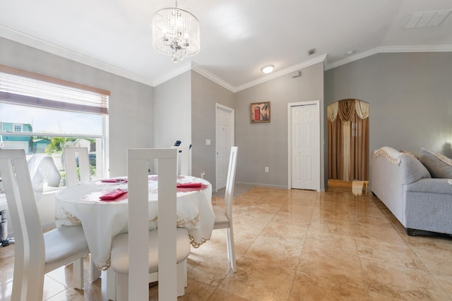 dining space featuring an inviting chandelier, lofted ceiling, and ornamental molding