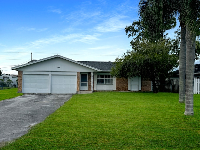 ranch-style home featuring a front yard and a garage