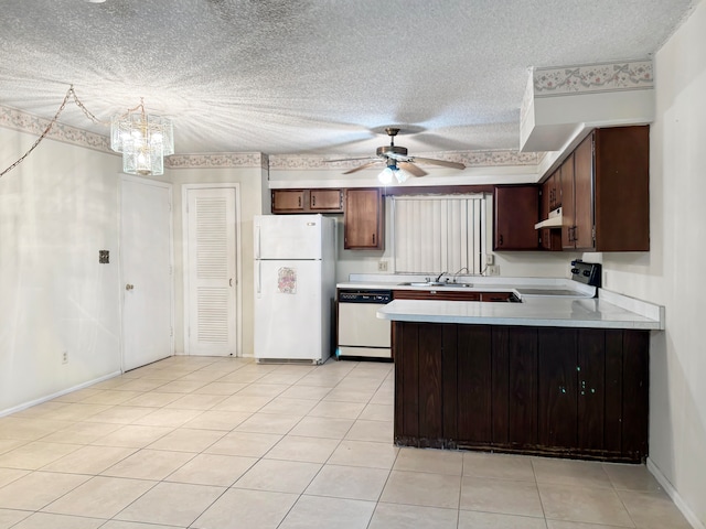 kitchen with light tile patterned floors, kitchen peninsula, white appliances, a textured ceiling, and ceiling fan with notable chandelier