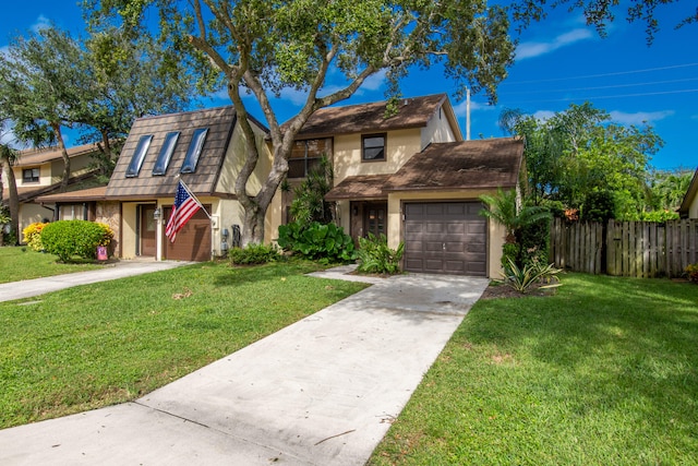 view of front facade with a front lawn and a garage