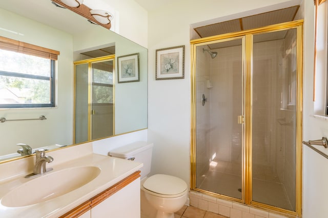 bathroom with toilet, walk in shower, vanity, and tile patterned flooring