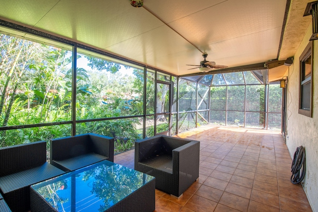 sunroom / solarium featuring ceiling fan and a wealth of natural light