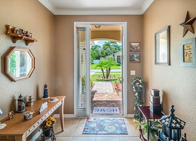 tiled entryway with a wealth of natural light and crown molding