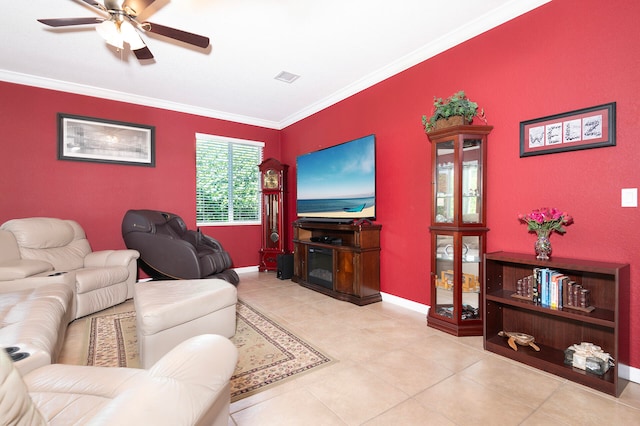 tiled living room featuring ceiling fan and crown molding