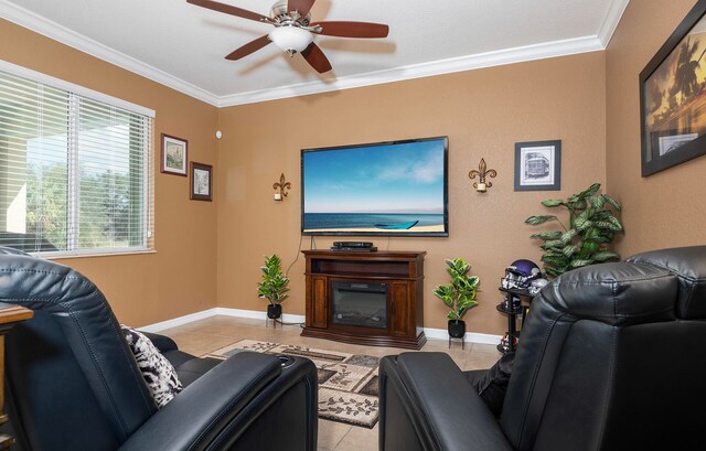 living room with ornamental molding, ceiling fan, and light tile patterned floors