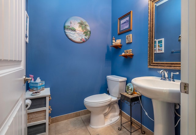 bathroom featuring tile patterned floors and toilet