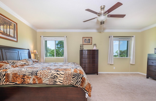 bedroom featuring light carpet, ceiling fan, and crown molding