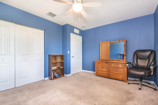 office area with light carpet and ceiling fan