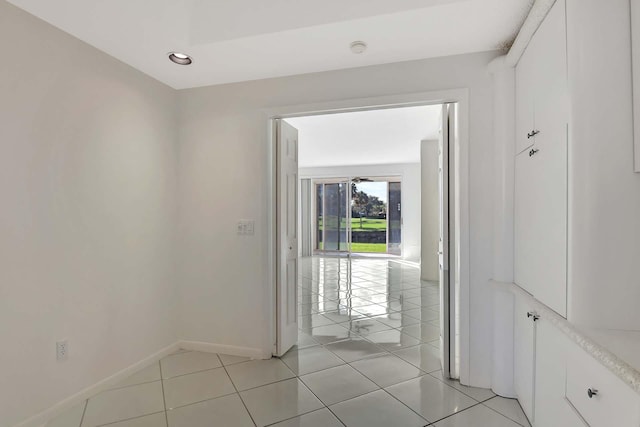 hallway with light tile patterned floors