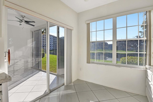 entryway featuring light tile patterned floors and ceiling fan