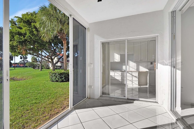 entryway featuring a wealth of natural light and light tile patterned floors