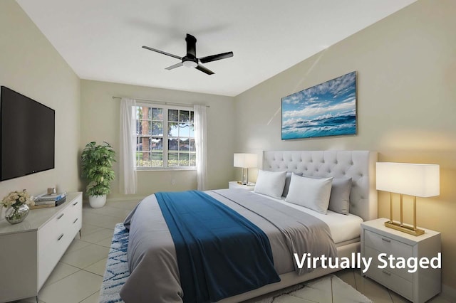 tiled bedroom featuring ceiling fan