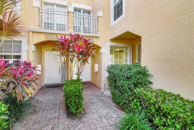 doorway to property featuring a balcony