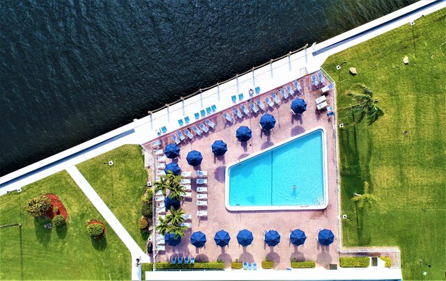 view of pool featuring a water view