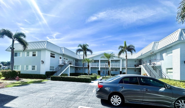 view of building exterior featuring stairway and a residential view