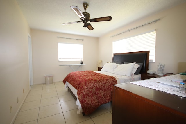 bedroom featuring ceiling fan and light tile patterned floors