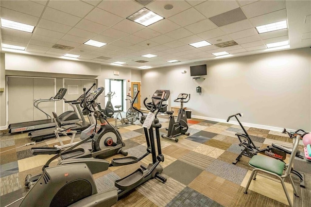 workout area with a drop ceiling