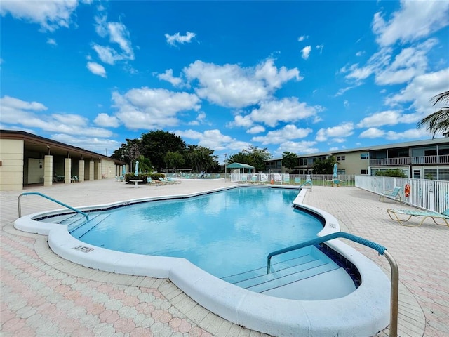 view of swimming pool featuring a patio area