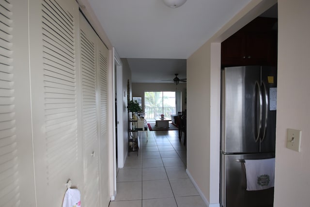 hall featuring light tile patterned floors