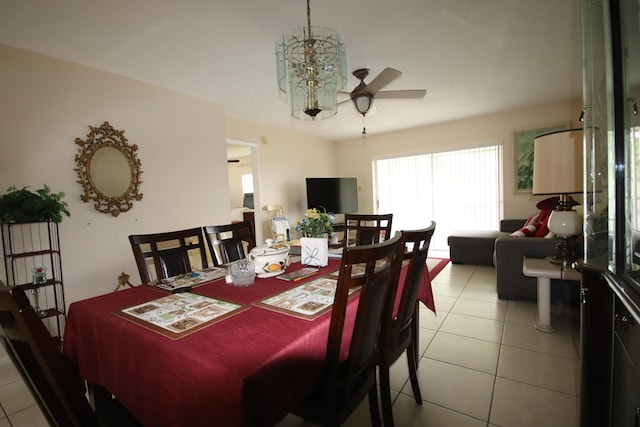 tiled dining area with ceiling fan