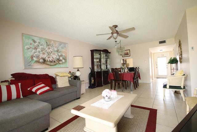 living room with ceiling fan and light tile patterned floors