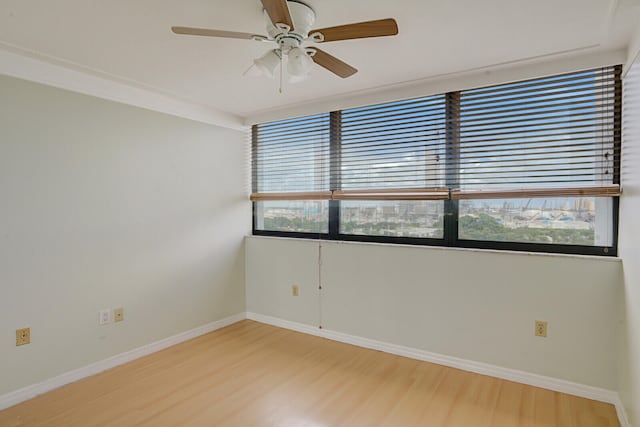 unfurnished room featuring light wood-type flooring and ceiling fan