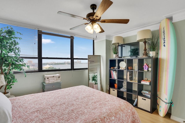 bedroom with light wood-type flooring and ceiling fan