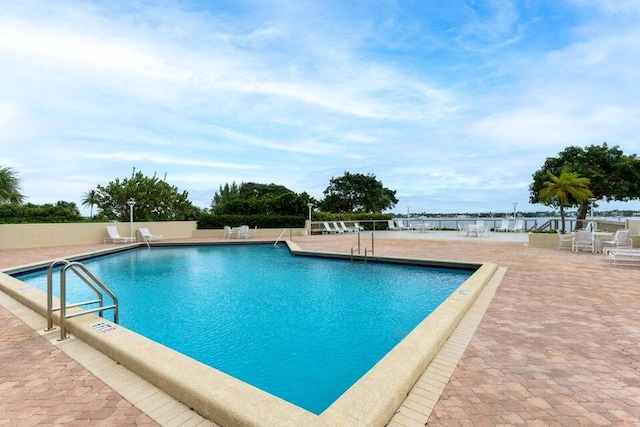 view of swimming pool with a patio area