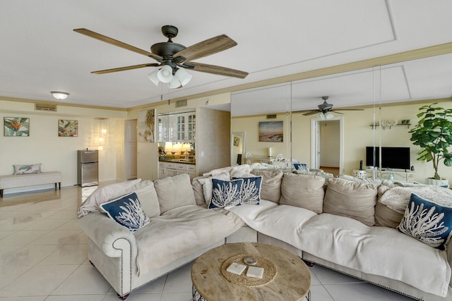 tiled living room featuring ceiling fan