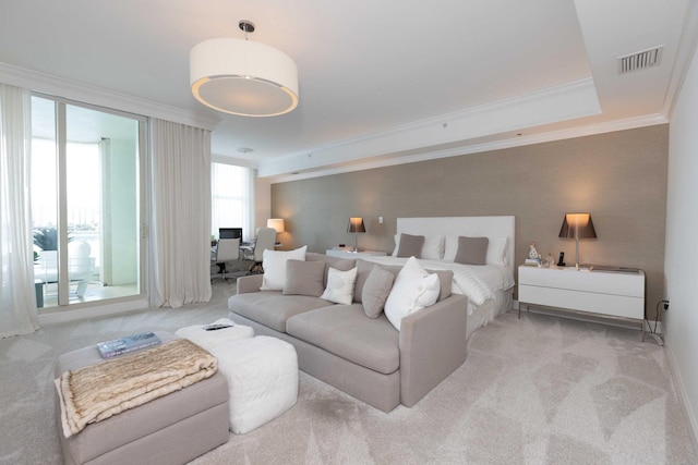 bedroom with crown molding and light colored carpet