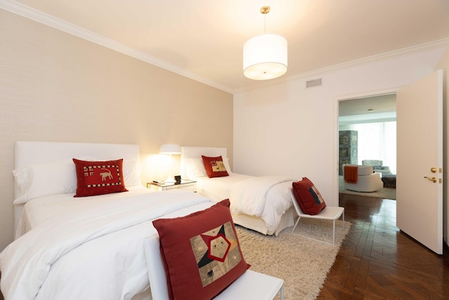 bedroom featuring dark parquet flooring and ornamental molding