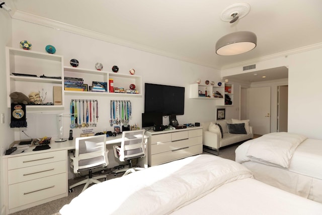 carpeted bedroom featuring built in desk and crown molding