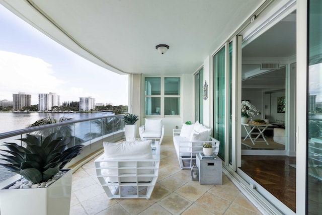 balcony featuring a water view