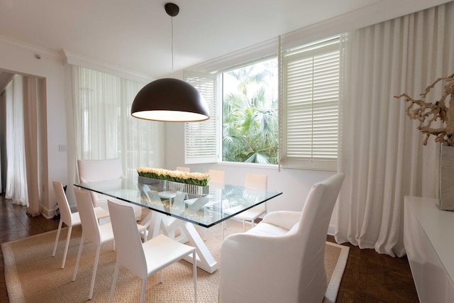 dining space featuring ornamental molding