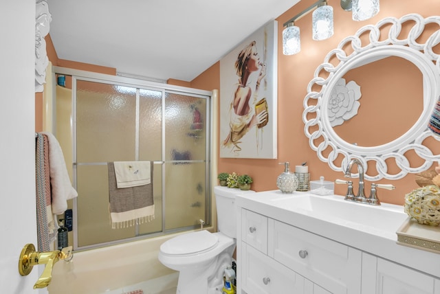 full bathroom with shower / bath combination with glass door, toilet, and vanity