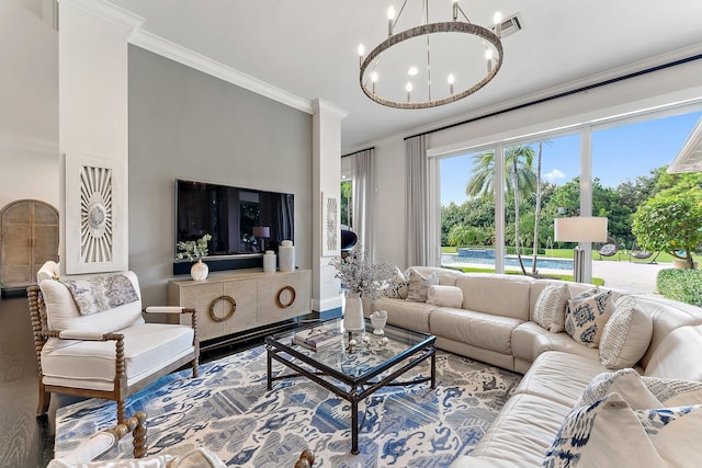 living room featuring ornamental molding and an inviting chandelier