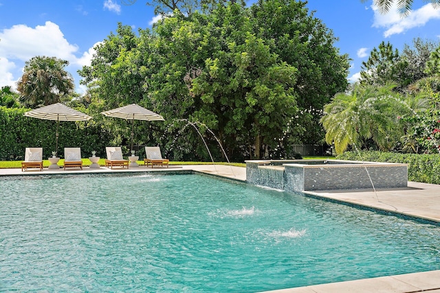 view of pool featuring an in ground hot tub, a patio, and pool water feature