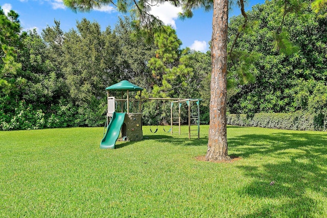 view of playground featuring a lawn