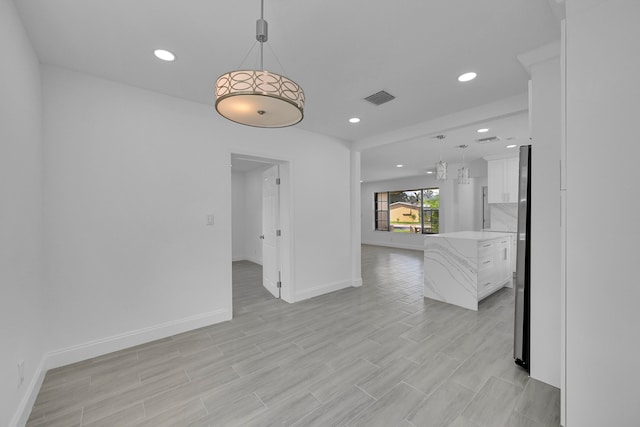 unfurnished room featuring light wood-type flooring