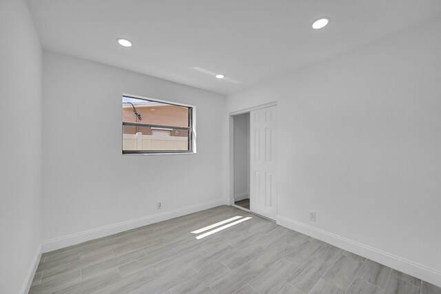 empty room with light hardwood / wood-style floors