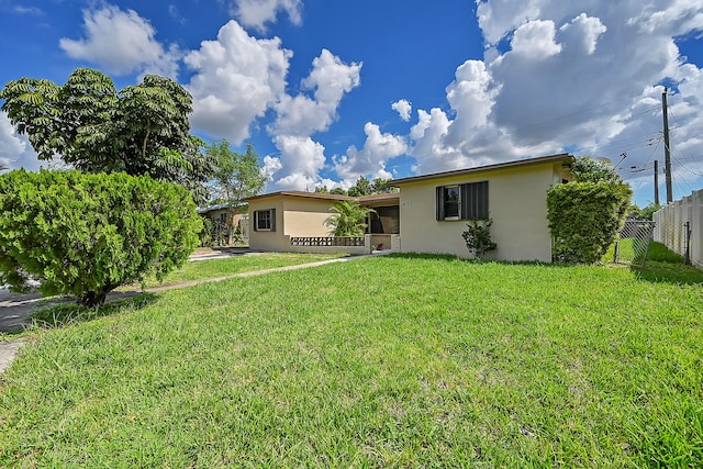 ranch-style house with a front yard